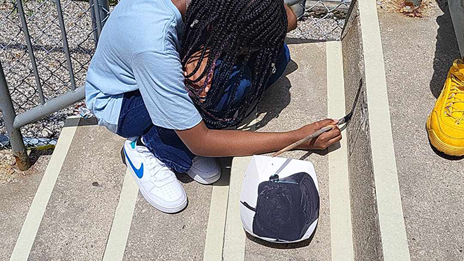 K-8 School in East Cleveland: Apex Academy Art Club and Art Teacher painted Moral Focus virtues on the school's back steps as part of a summer break project.