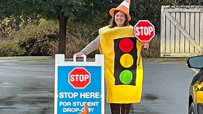 Dean Nikki Fife dressed as a stoplight.
