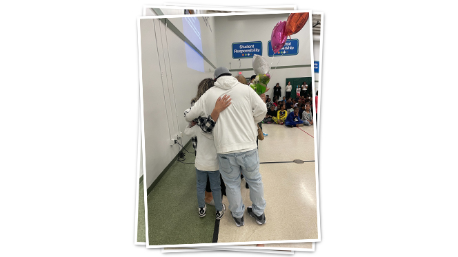 Teacher hugging family.
