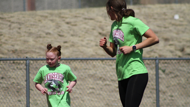 Melissa Mendez runs with a student