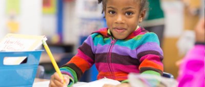 Student completing work in classroom
