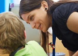 Teacher helping students