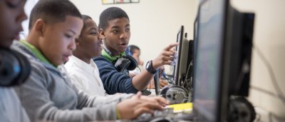 Students completing work on computer