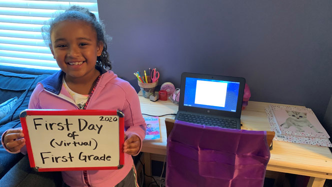 Student celebrating first day of virtual first grade.