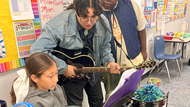 K-6 School in Commerce City: Capstone Academy music students welcomed members of a local band to sit with them during their rehearsal.