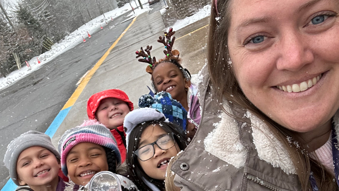 Dana Gurganus in the snow with her students.